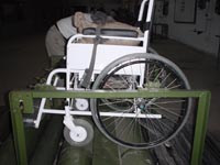close up photo of wheelchair on double drum machine