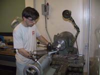 photo of person making plastid end caps on the lathe